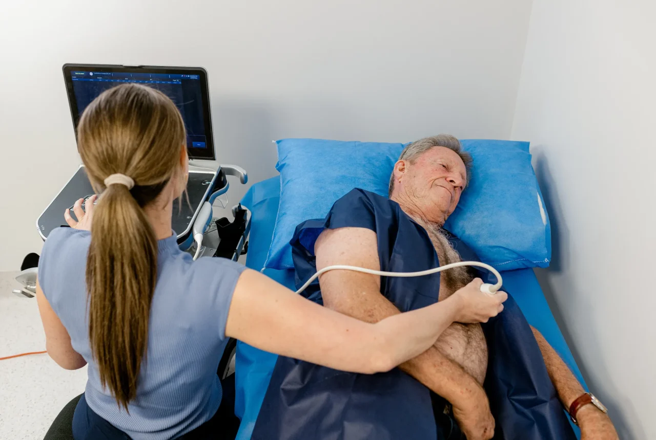 A nurse conducting a heart test