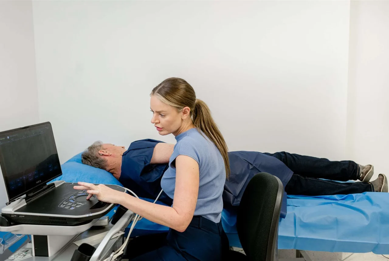 Practice Manager Selene Thannheiser running a test on a patient
