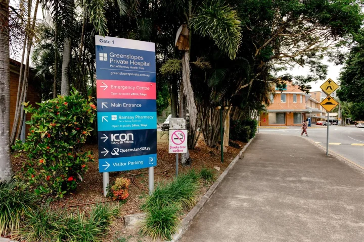 Signs at the main entrance of Brisbane Greenslopes Hospital
